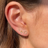 Three Gold and Diamond Stud Earrings on Ear