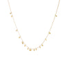 Sia Taylor Tiny Random Dots Necklace is a constellation of tiny hammered discs cascading on a gold chain