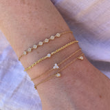 Four Stacked Gold and Diamond Bracelets