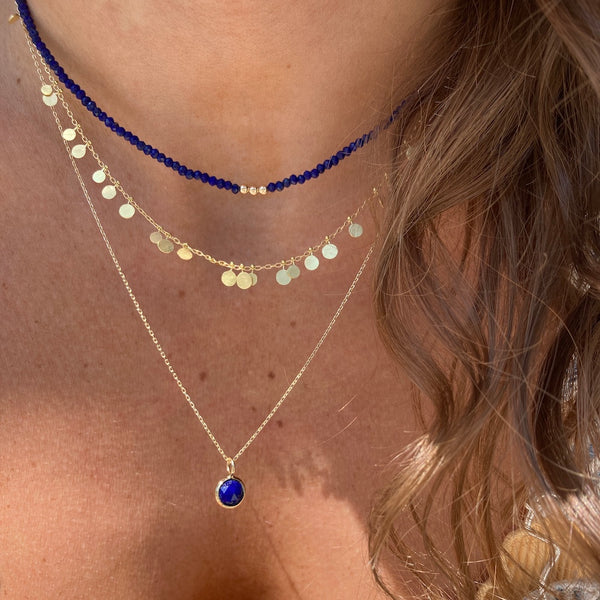 The random dots necklace is paired with our three wishes lapis necklace and the enlightenment lapis necklace