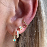 The opals from the Beatrix Australian opal studs compliment the opal inlay huggie hoops as well as the seraphina drop opal hoops and the nefertiti cuff looks amazing next to the tiniest gold ball stud.