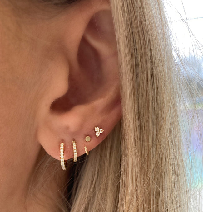 These sacred sapphire studs look amazing with our three best selling huggies. Starting with the biggest are the Ava diamond huggie hoops, next the tiniest diamond huggie hoops and finally the tiniest huggie. 
