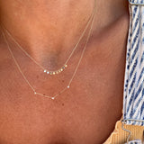 The gypsy wish necklace layered with our trios diamond necklace