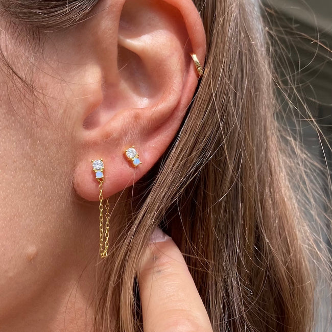 The opal & cz studs are paired with out Charlie chained studs. 