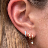 These starry night opal drop earrings are paired with our Sylvie opal huggies and opal inlay hoops