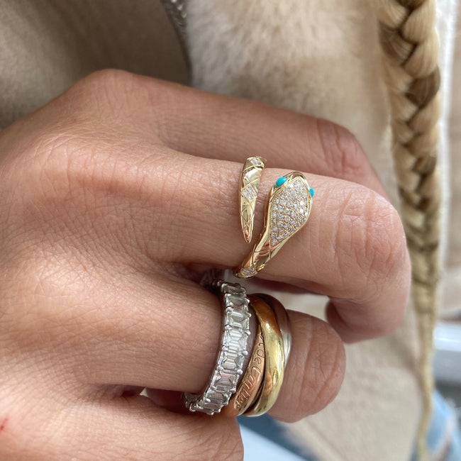 Diamond and Turquoise Snake Ring with an Emerald Cut Diamond Eternity Band and a Cartier Love Ring