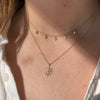 The Sunburst diamond necklace is paired with our dew drop diamond station necklace