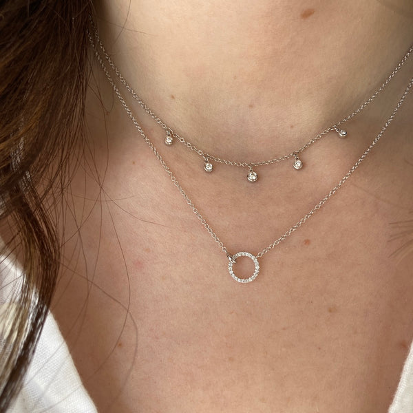 The white gold forever interlocking circle diamond necklace is paired with our white gold dew drop diamond station necklace.