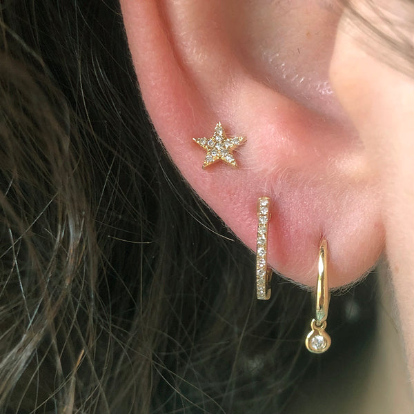 Three Gold and Diamond Studs and Huggie Hoops on Ear