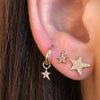 Three Different Diamond Star Earrings on Ear