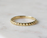 Gold Eternity Band with Studded Pyramid Detail