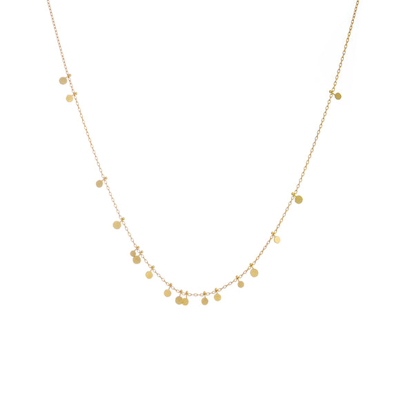 Sia Taylor Tiny Random Dots Necklace is a constellation of tiny hammered discs cascading on a gold chain